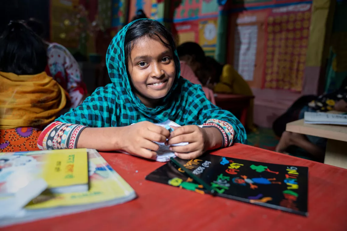 Kulsum,10, smiles at the camera during her daily class at the ABAL centre at Jhawchar.
