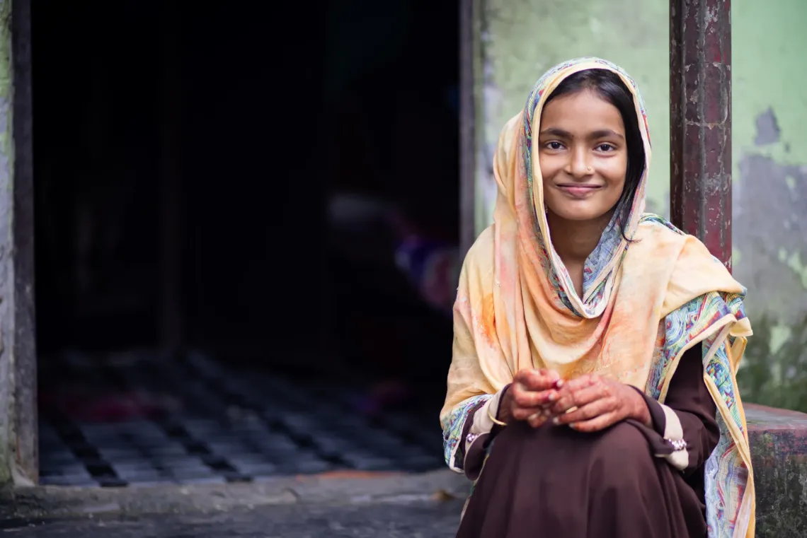  18-year-old Morjina with her son Abu Bakkar at their home in Cumilla, Bangladesh.
