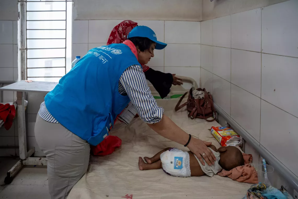 UNICEF staff visits a severe wasted baby at the Upazila Health Complex 
