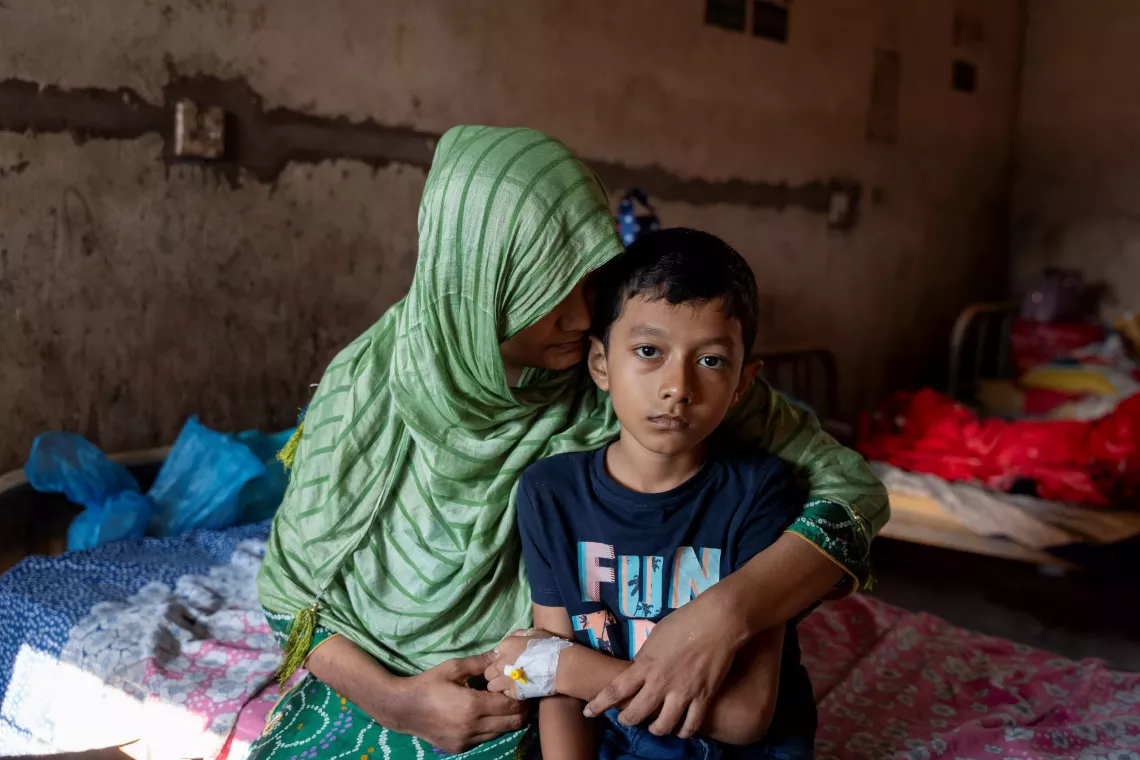 Bibi Kulsum is taking care of her child