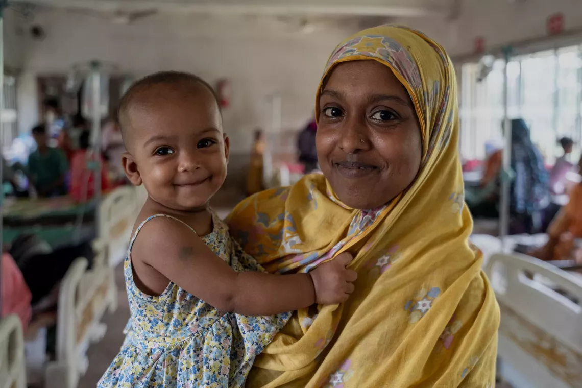 Najma Akhter, a mother of three, brings her nine-month-old baby Nusaiba to a upazila health complex 