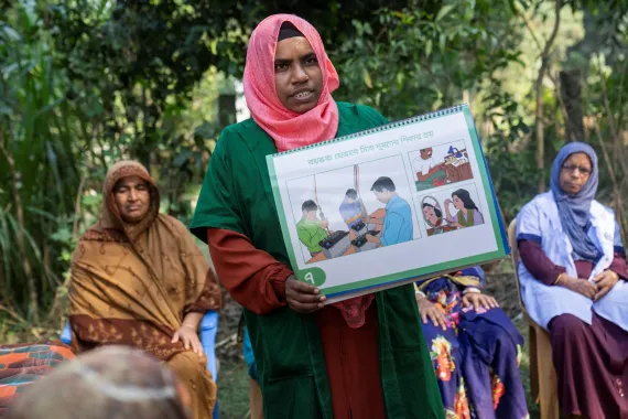 Community healthcare provider Asma Akter conducting an engaging community session in Tangail to educate local women about lead poisoning.