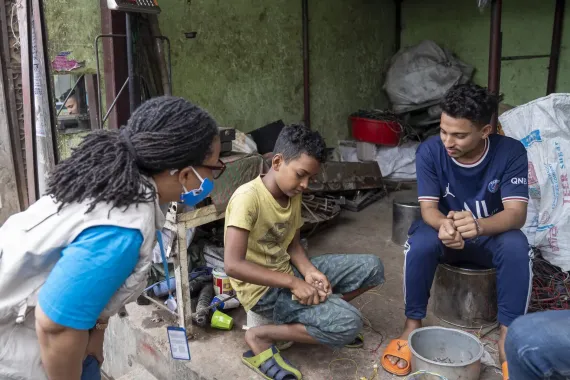 UNICEF staff Dr. Priscilla Wobil visits a local e-waste shop in Dhaka