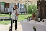 UNICEF Rep delivers opening remark standing at a microphone stand