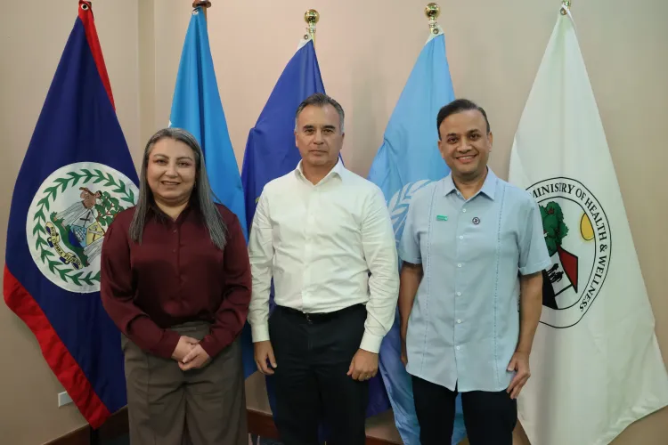 Officials pose before agency flags