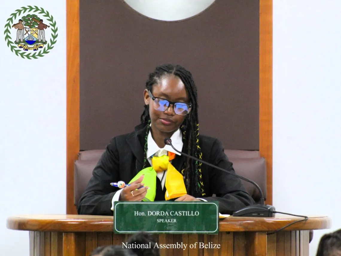 Girl sits at table as head of the meeting