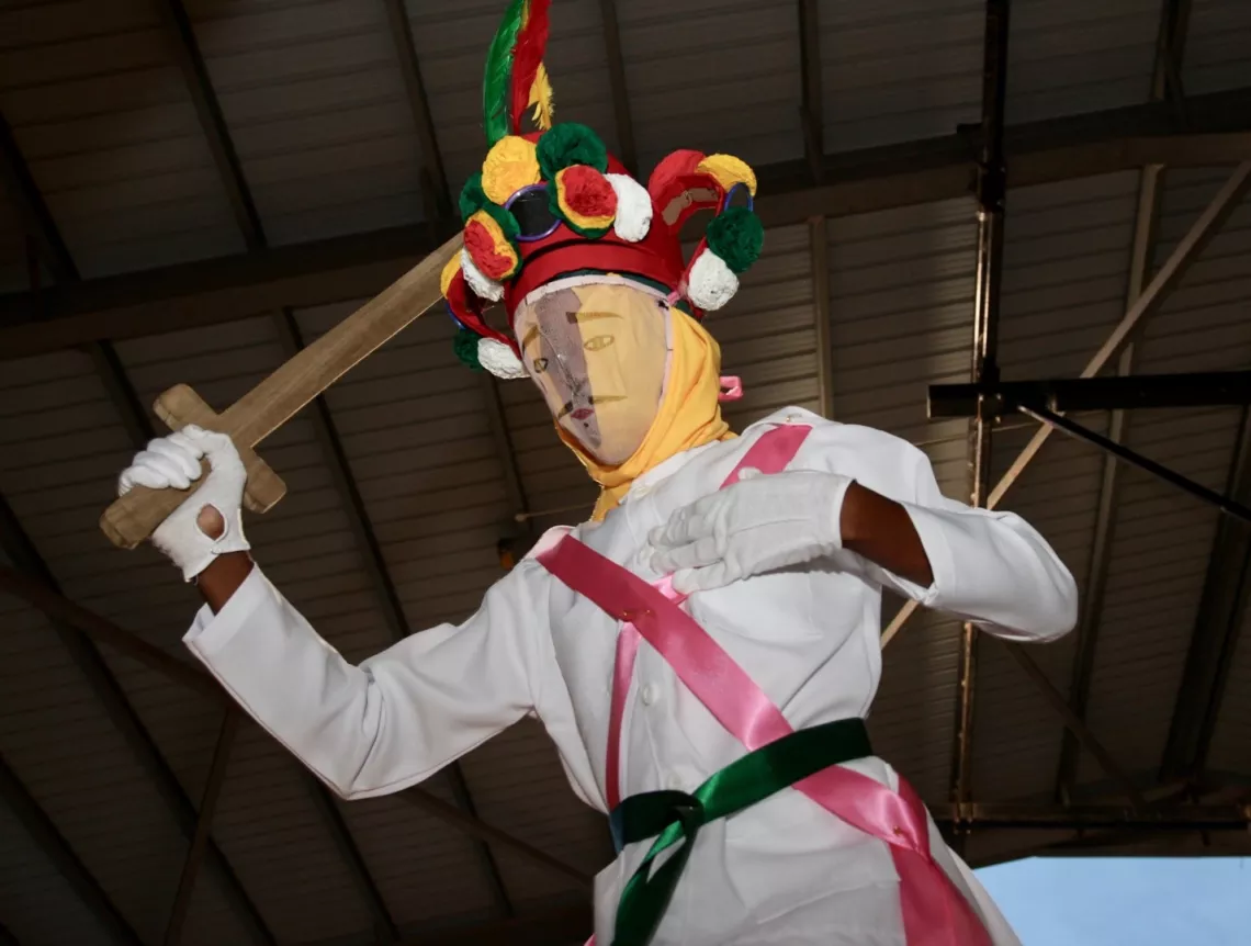 The Bankuata (swordsman) keeps the dancers in step. Wanaragua is unique in that the dancers lead and the drummers follow. 