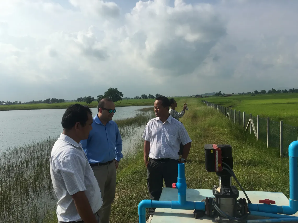 Men in field exploring equipment