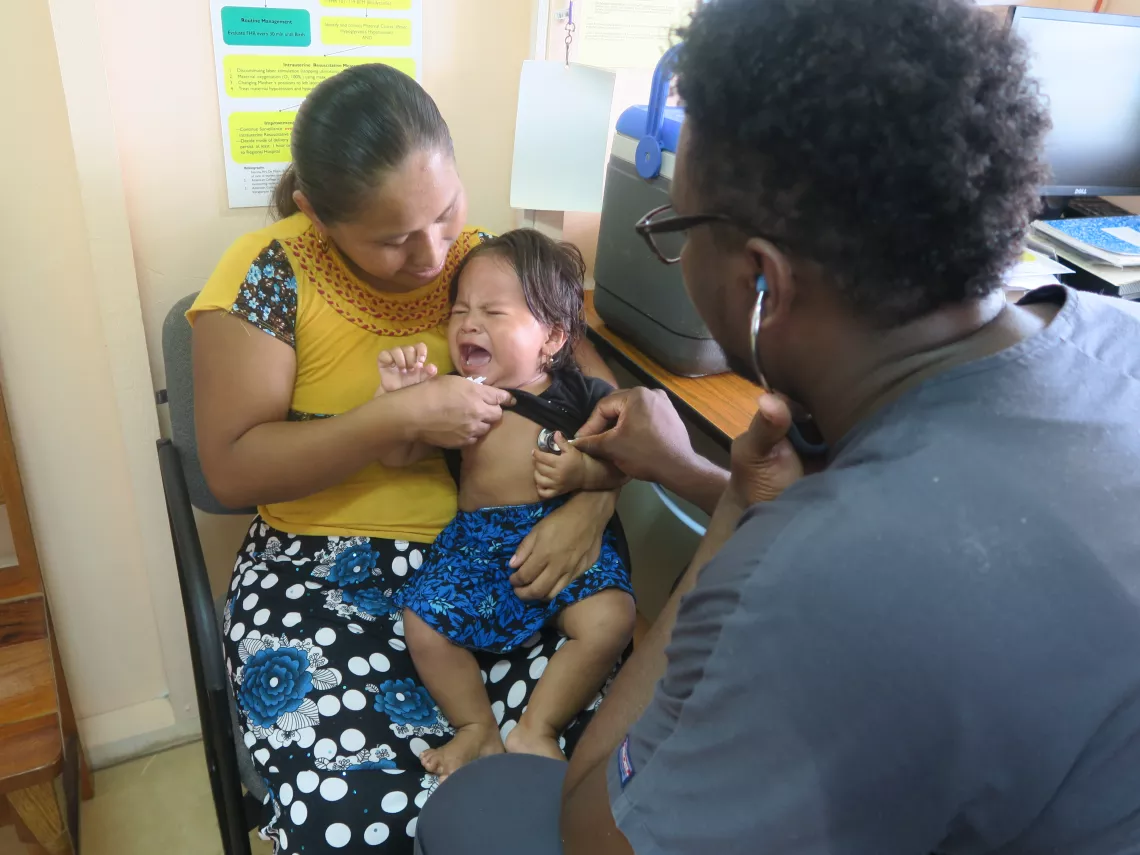 baby and mother visiting doctor