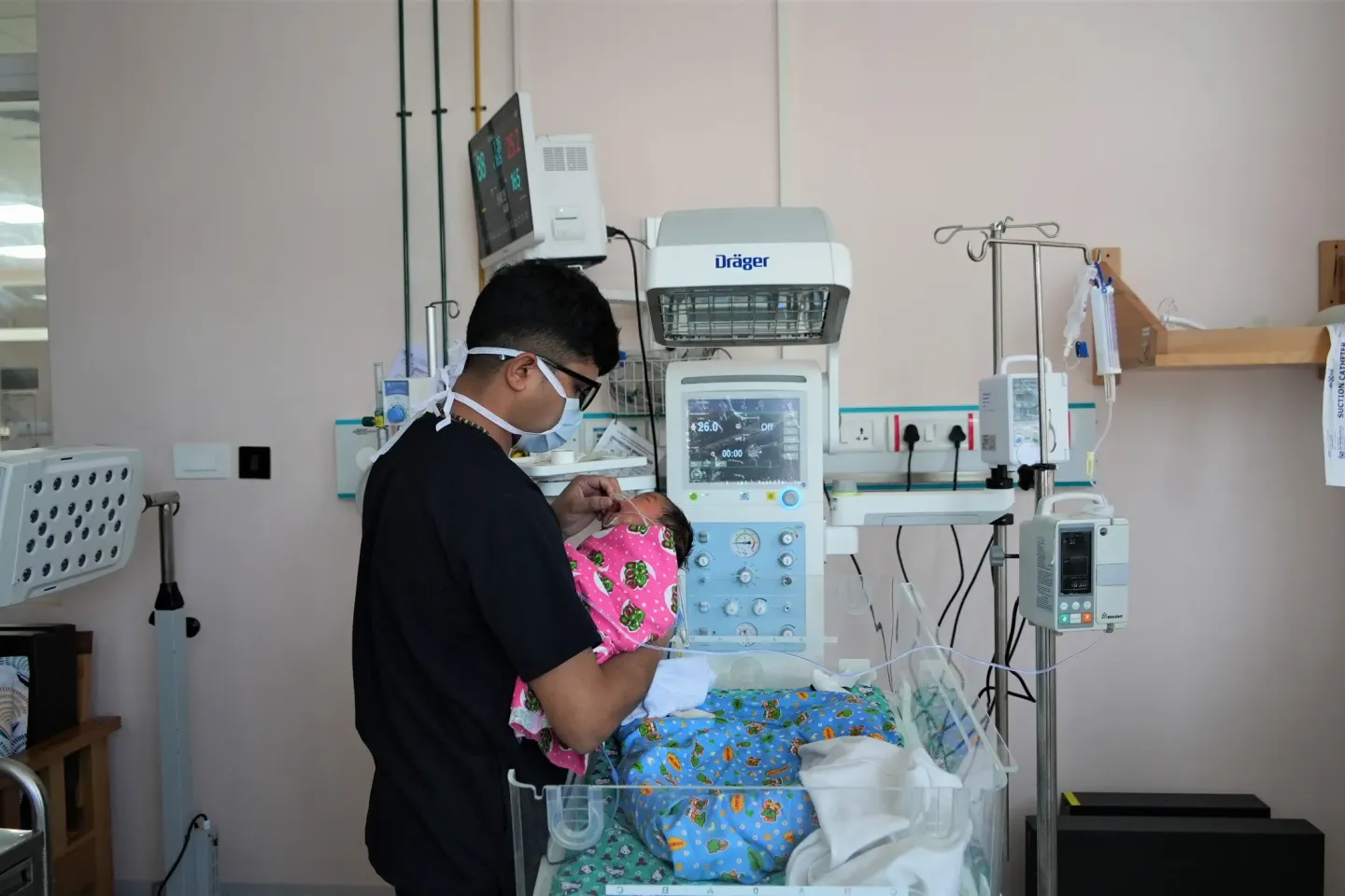 A nurse attends to a newborn at the Mother and Child Hospital 