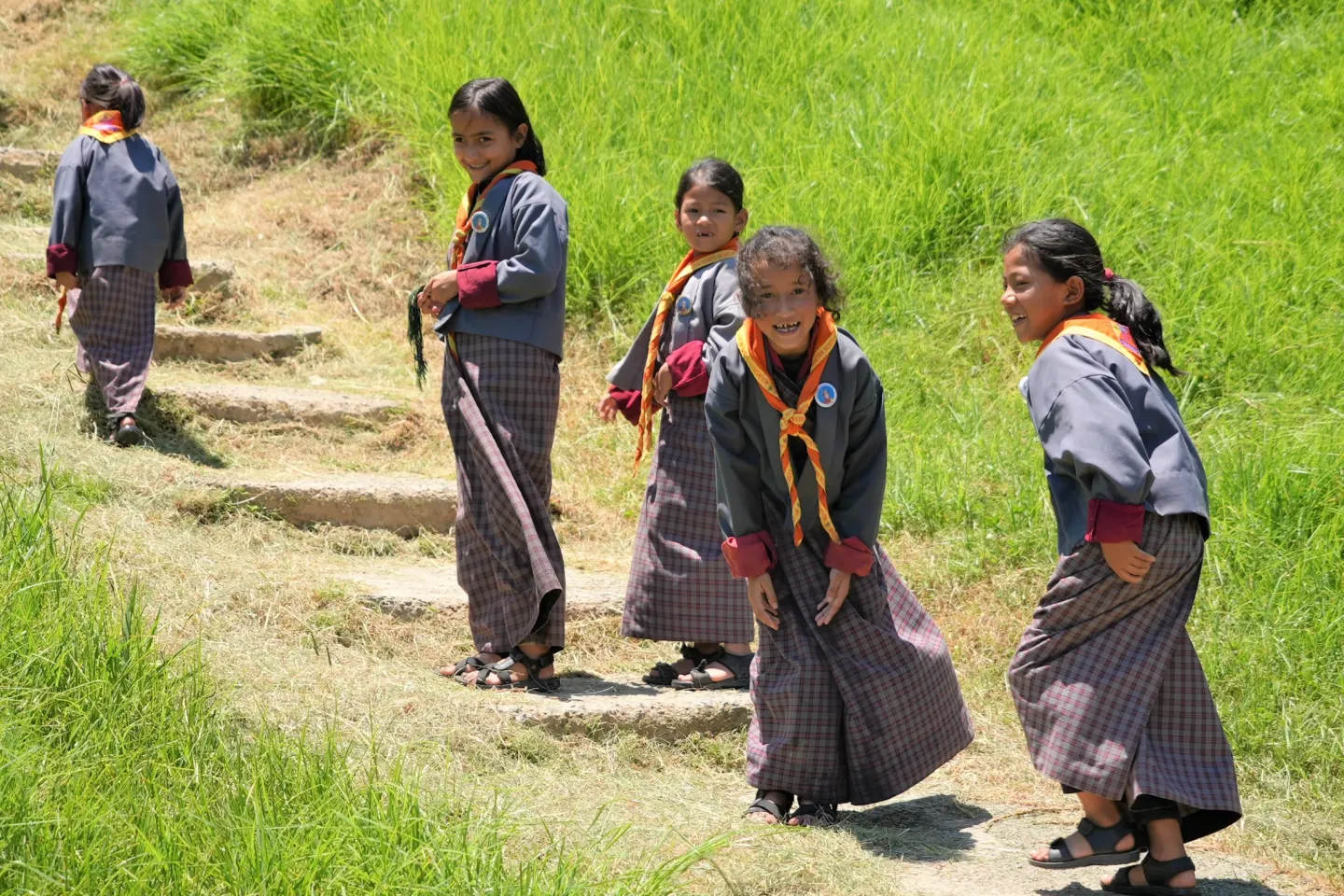 A group of girl students walk up to their class in Chukha