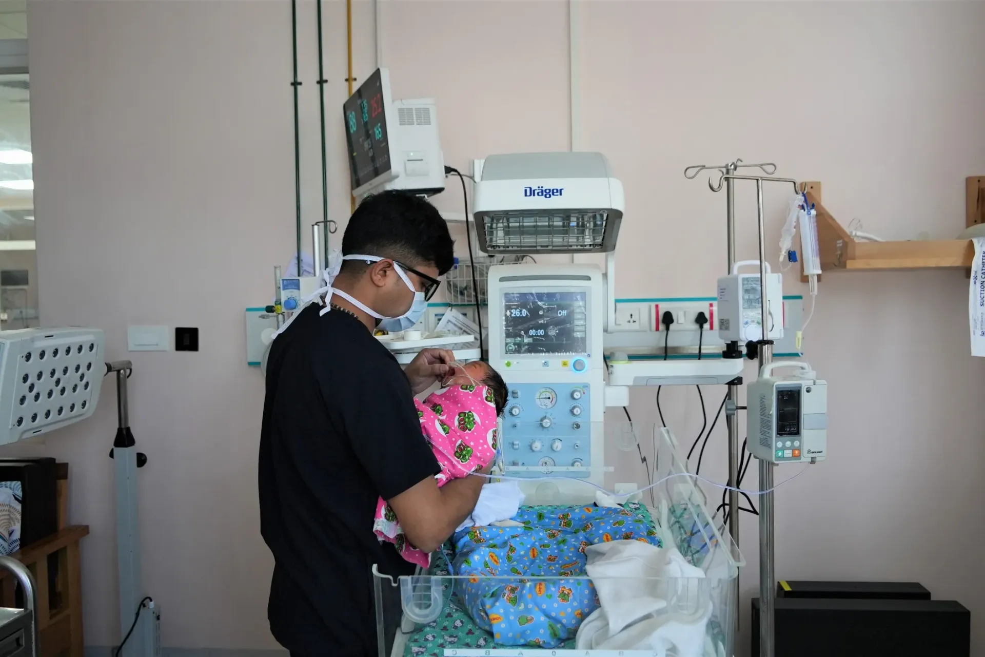 A nurse attends to a newborn at the Mother and Child Hospital 