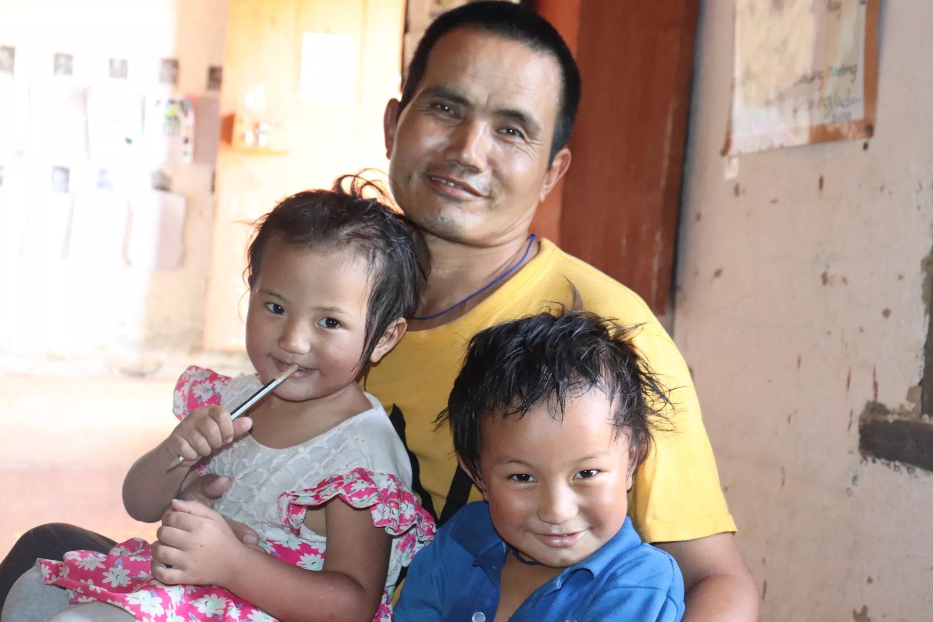 A father with his son and daughter