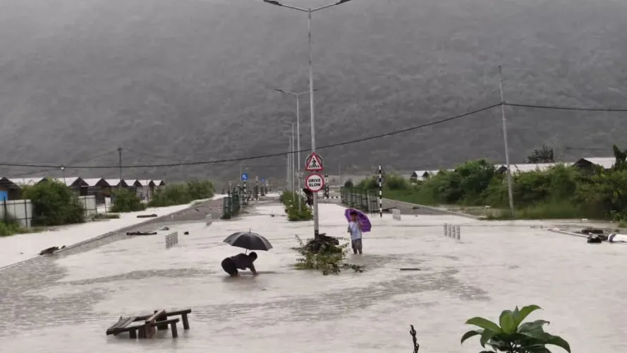 Residents in floodwaters at Amochu Temporary Settlement after heavy rainfall