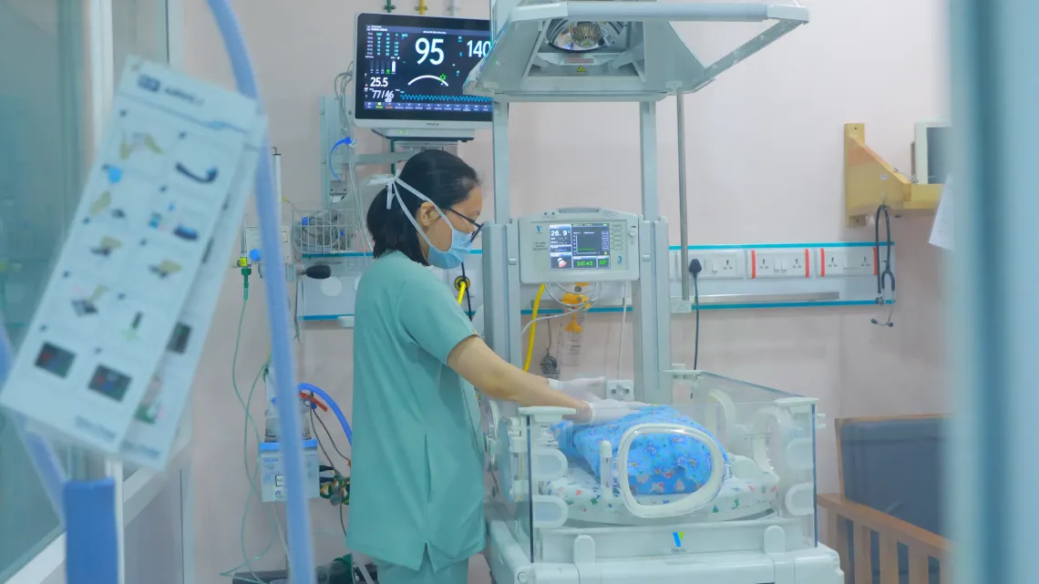 A nurse attends to a newborn at the NICU 
