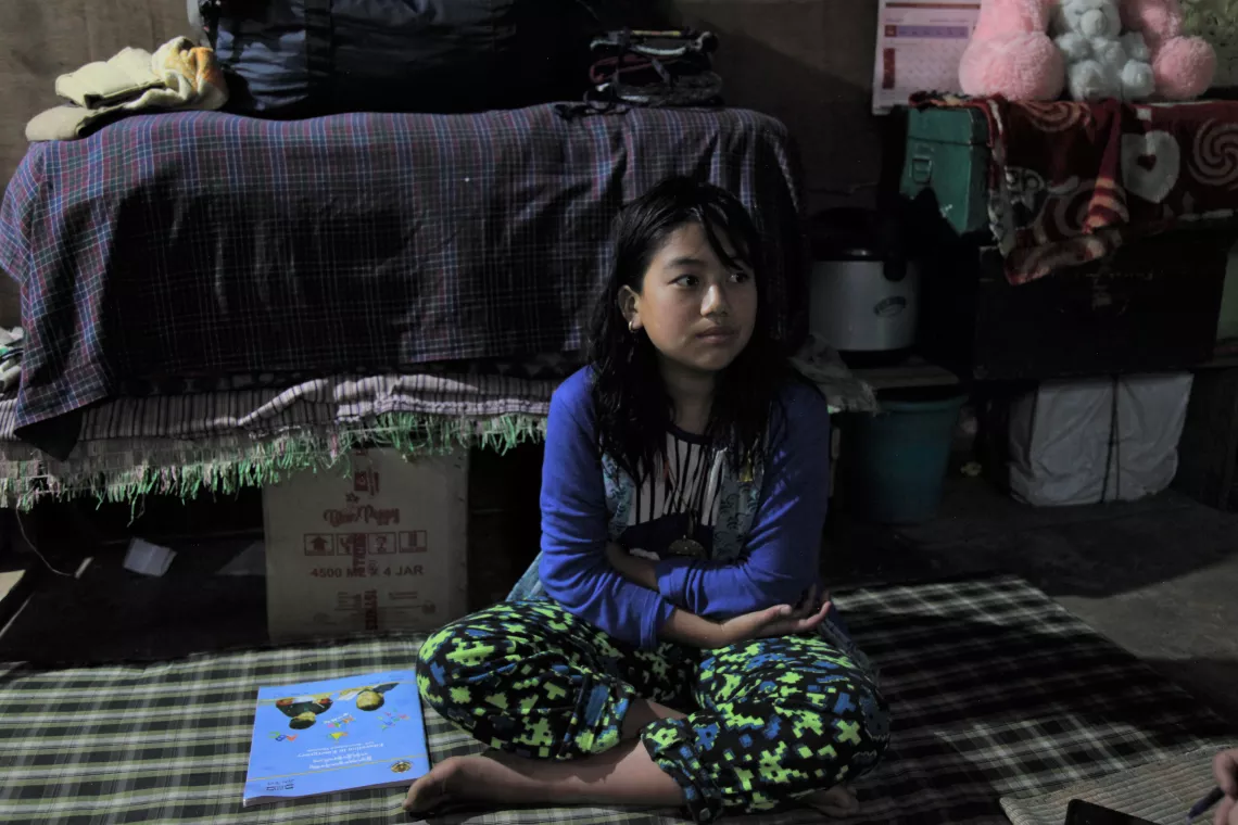 A girl with her books at home