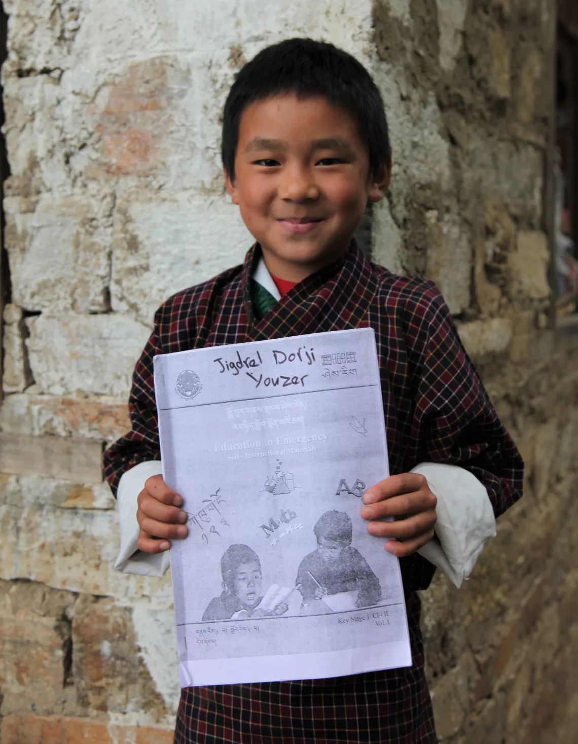 A boy with a copy of his SIM