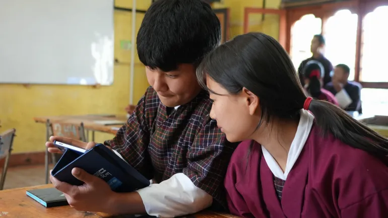 A boy and girl grade 10 student learn from their tablet at Chumey Central school in Bumthang, central Bhutan. 