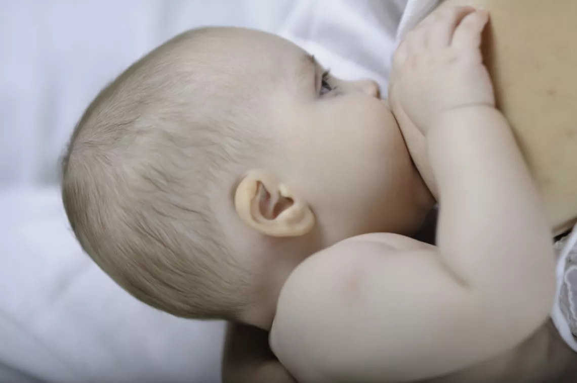 A baby bresatfeeding