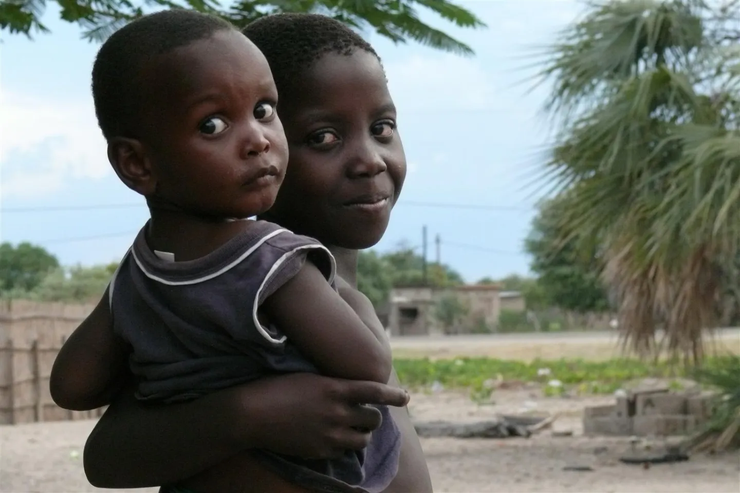 Children playing while mother is at work 
