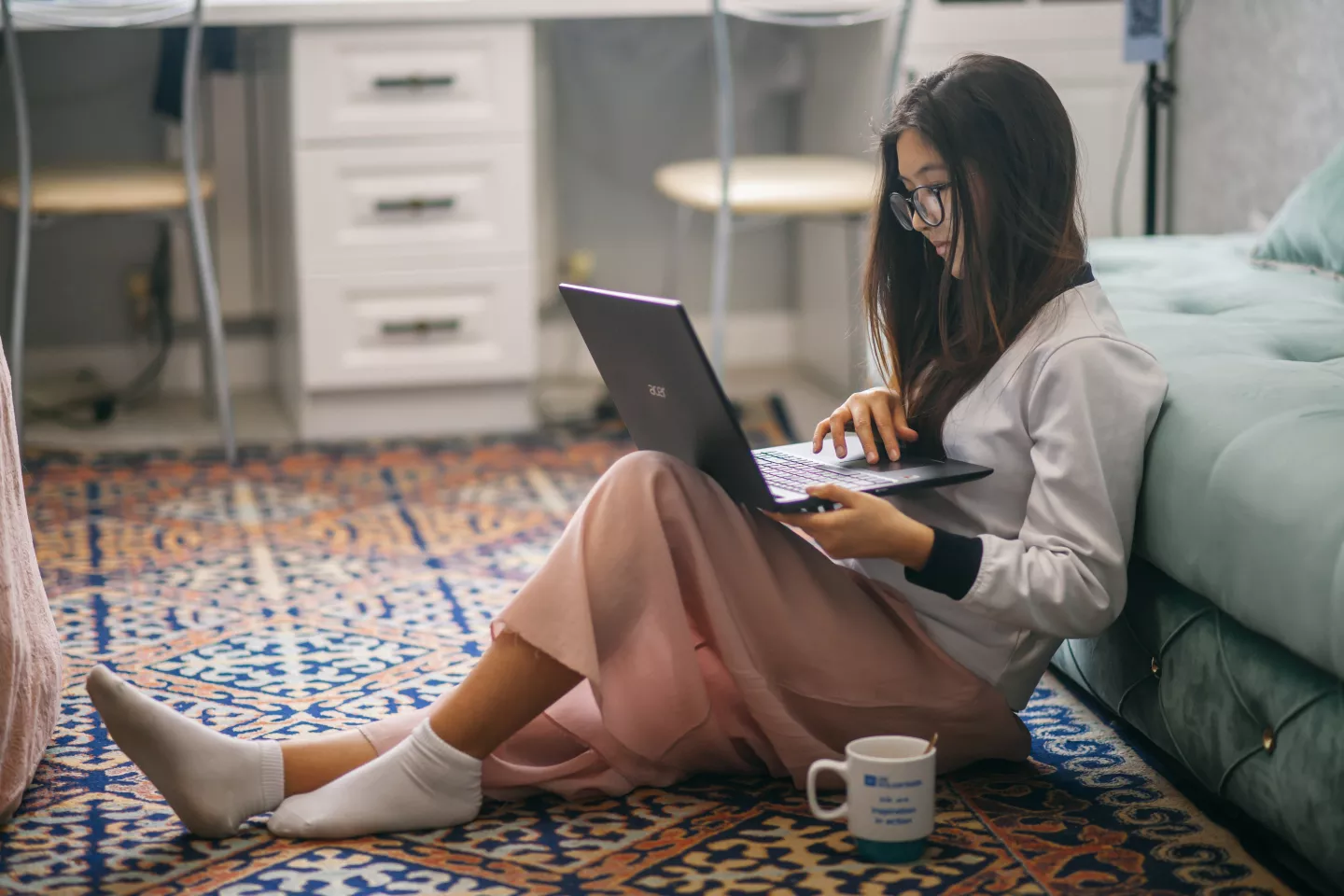 social media and teen mental health: A teenager on her laptop