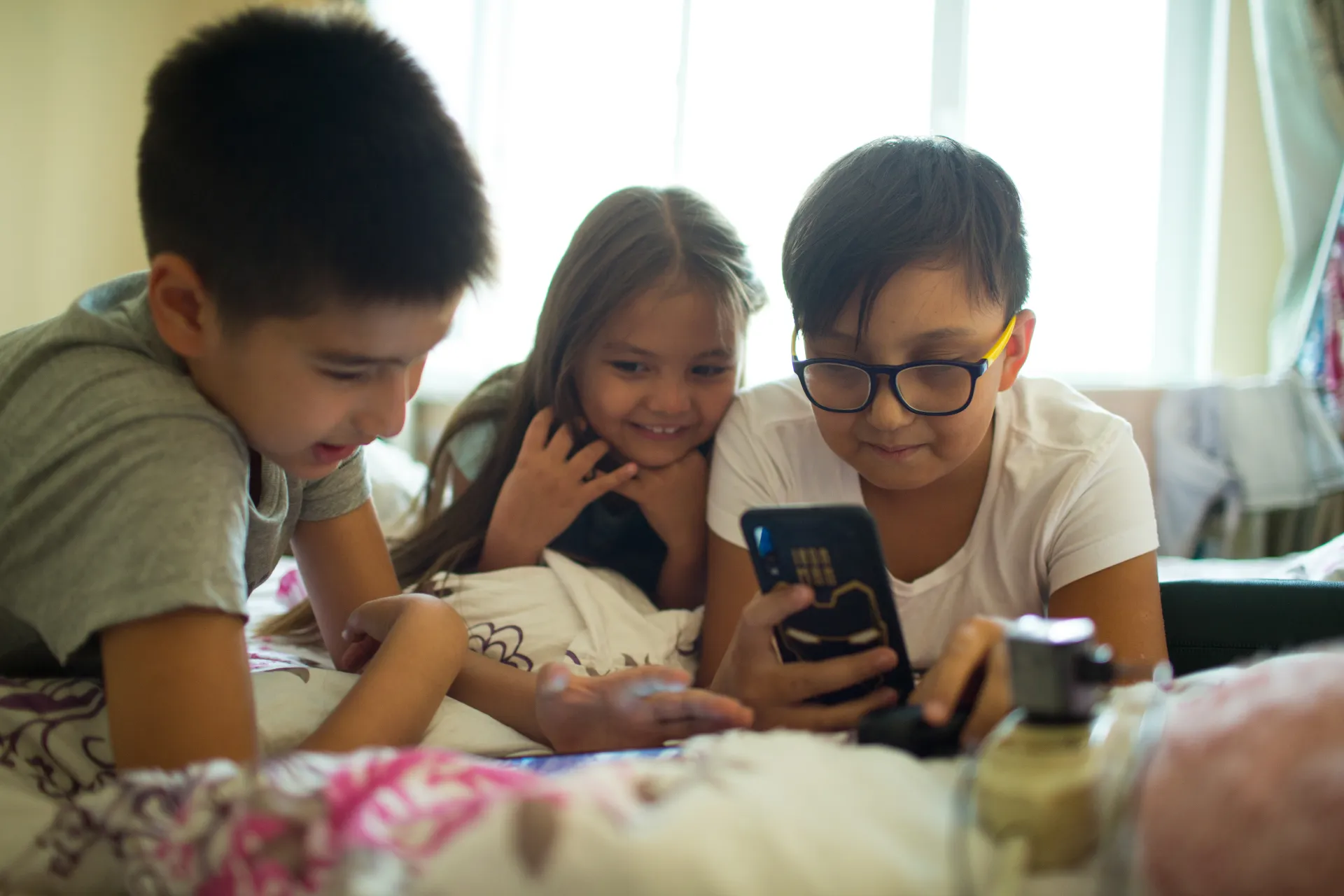 Kids perusing mobile phone