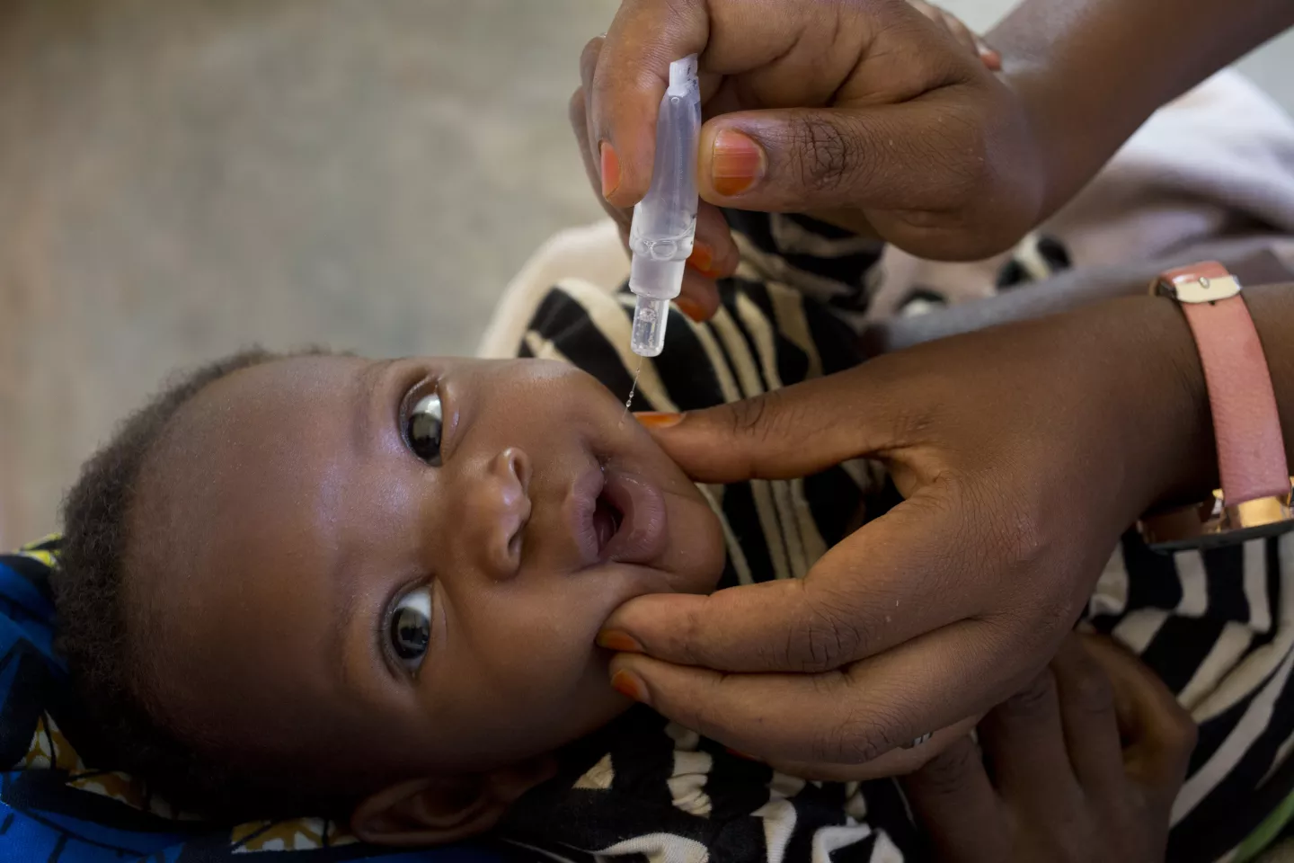 A child receives a polio vaccine at the Giheta health centre, Tuesday , 24, Sept 2019,in Gitega, Burundi.