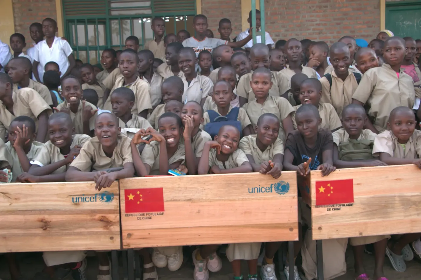 Students from ECOFO Gatumba VII with the new school desks provided through the partnership between the Government of Burundi, the People&rsquo;s Republic of China and UNICEF.