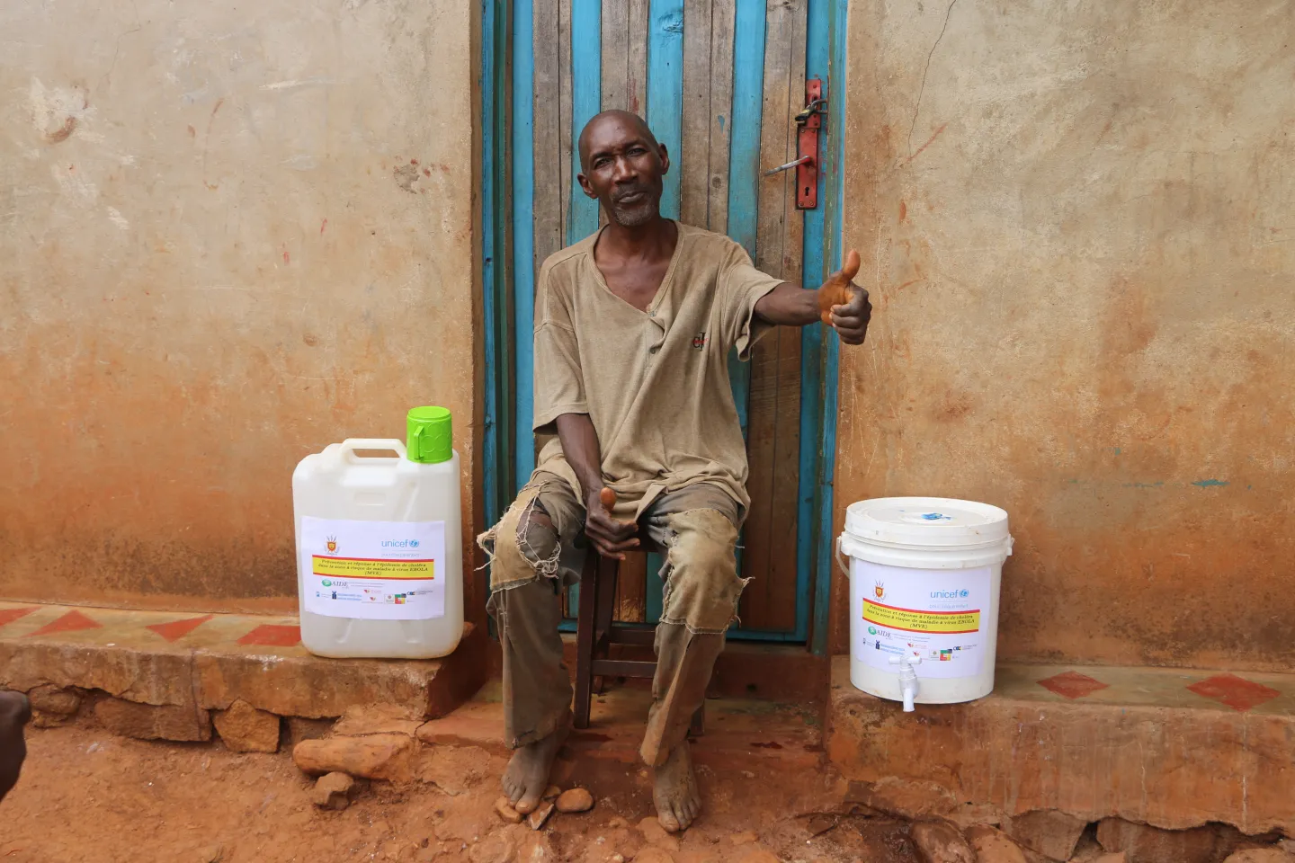 Cibitoke- Rugombo. NTAMAVYARIRO Elias in front of his house, with hygiene kits provided by the project