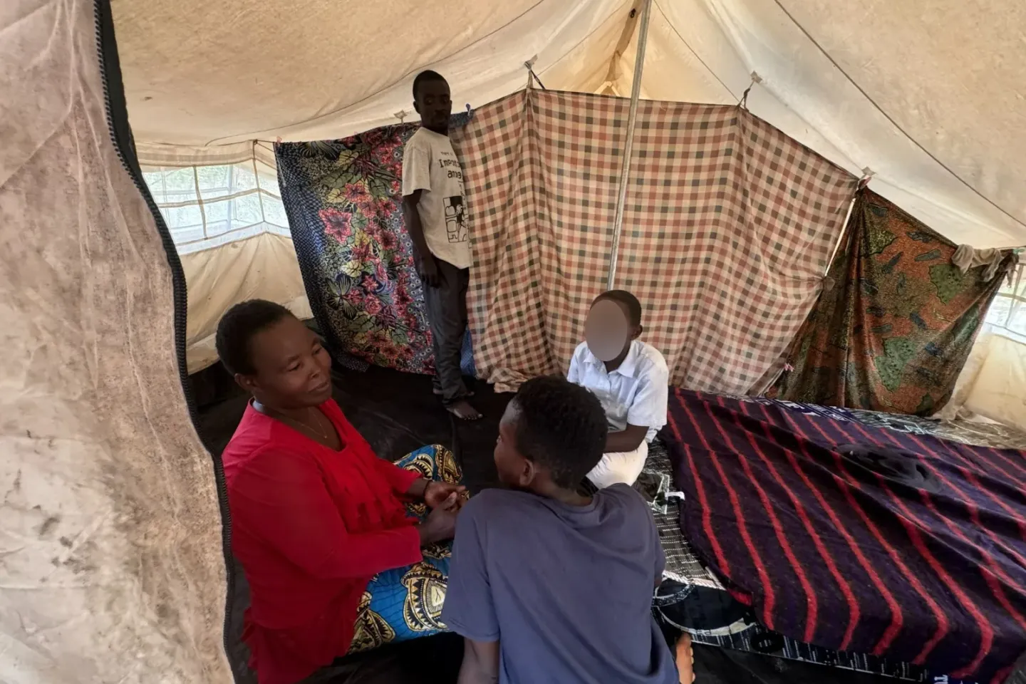 Two young boys reunited in a host family at the Musenyi II Congolese refugee site
