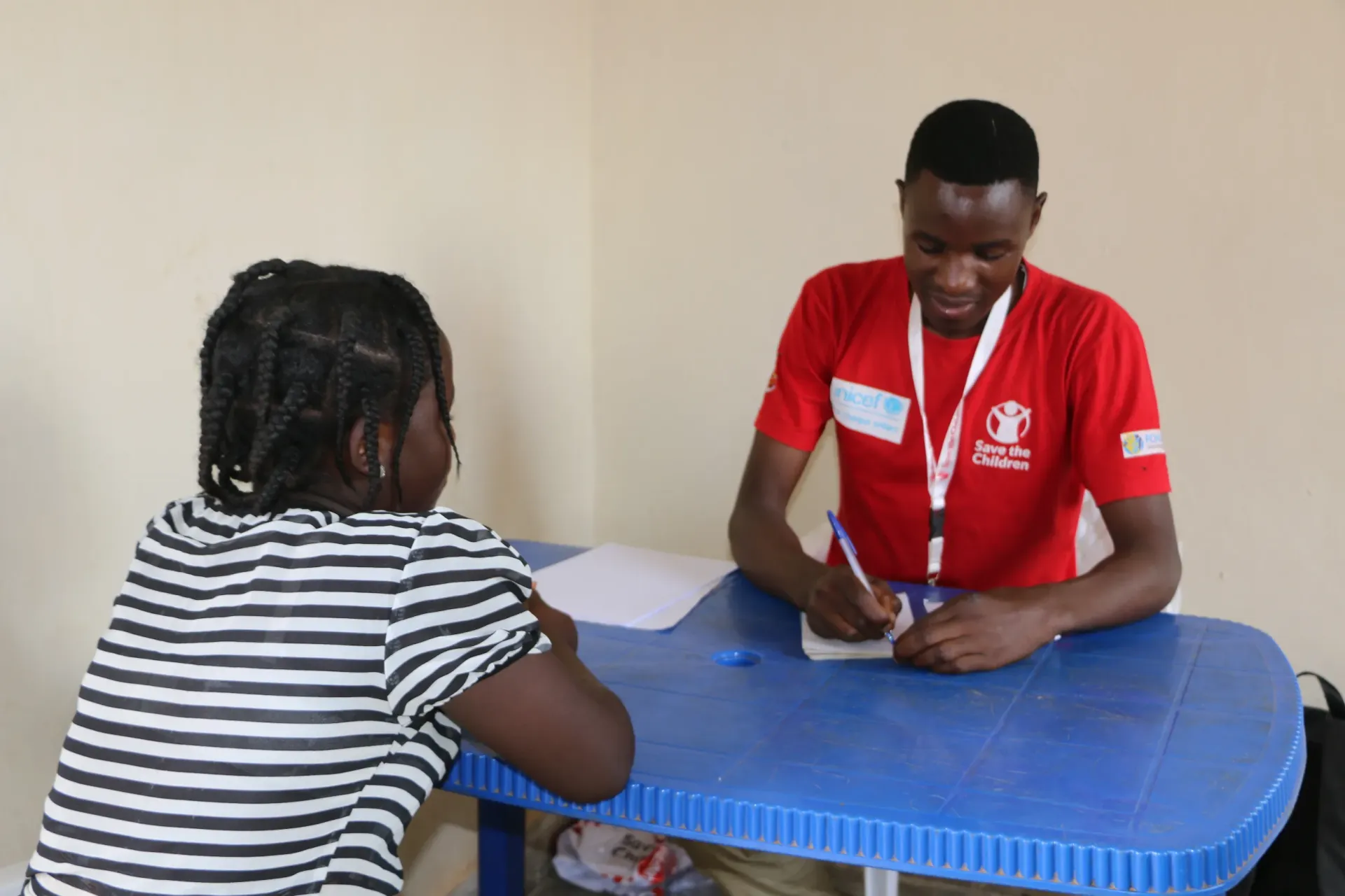 A Save the Children child protection caseworker conducting a protection assessment interview