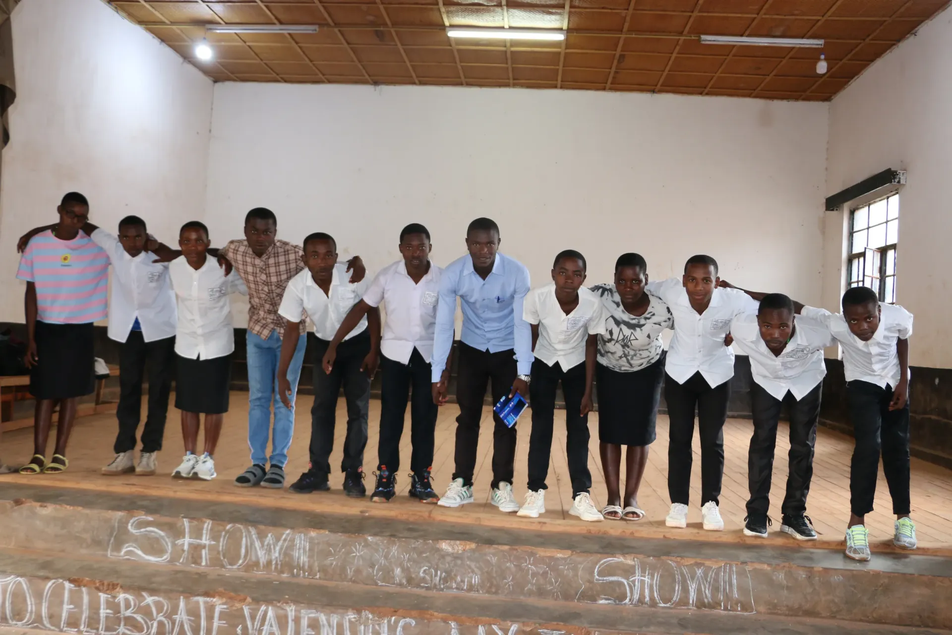 After their sketch raising awareness about unwanted pregnancies in schools, the pupils take a bow to applause from the audience.