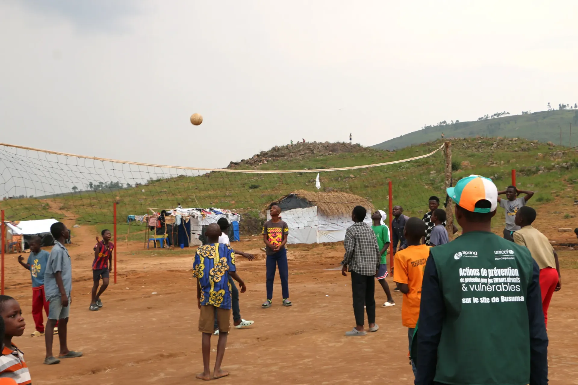 Refugee children from the Busuma site playing volleyball in the Child-Friendly Space set up by the NGO Spring Communities with UNICEF support. 
