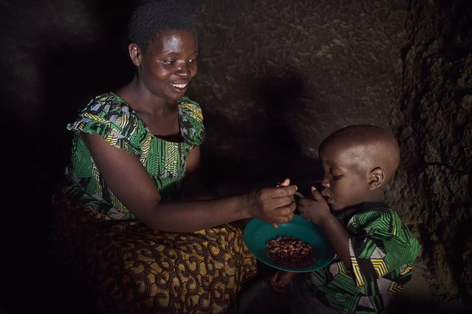 Mukawera feeds her 3 year old son Niyonizigiye. Mukawera Venatie, 32, has three children, 3 years old, 5 and 7, respectively. She is a member of SILC group organized by CONCERN, UNICEF&rsquo;S partner, in Kagege village of Busoni Commune in Kirundo Province in Burundi.