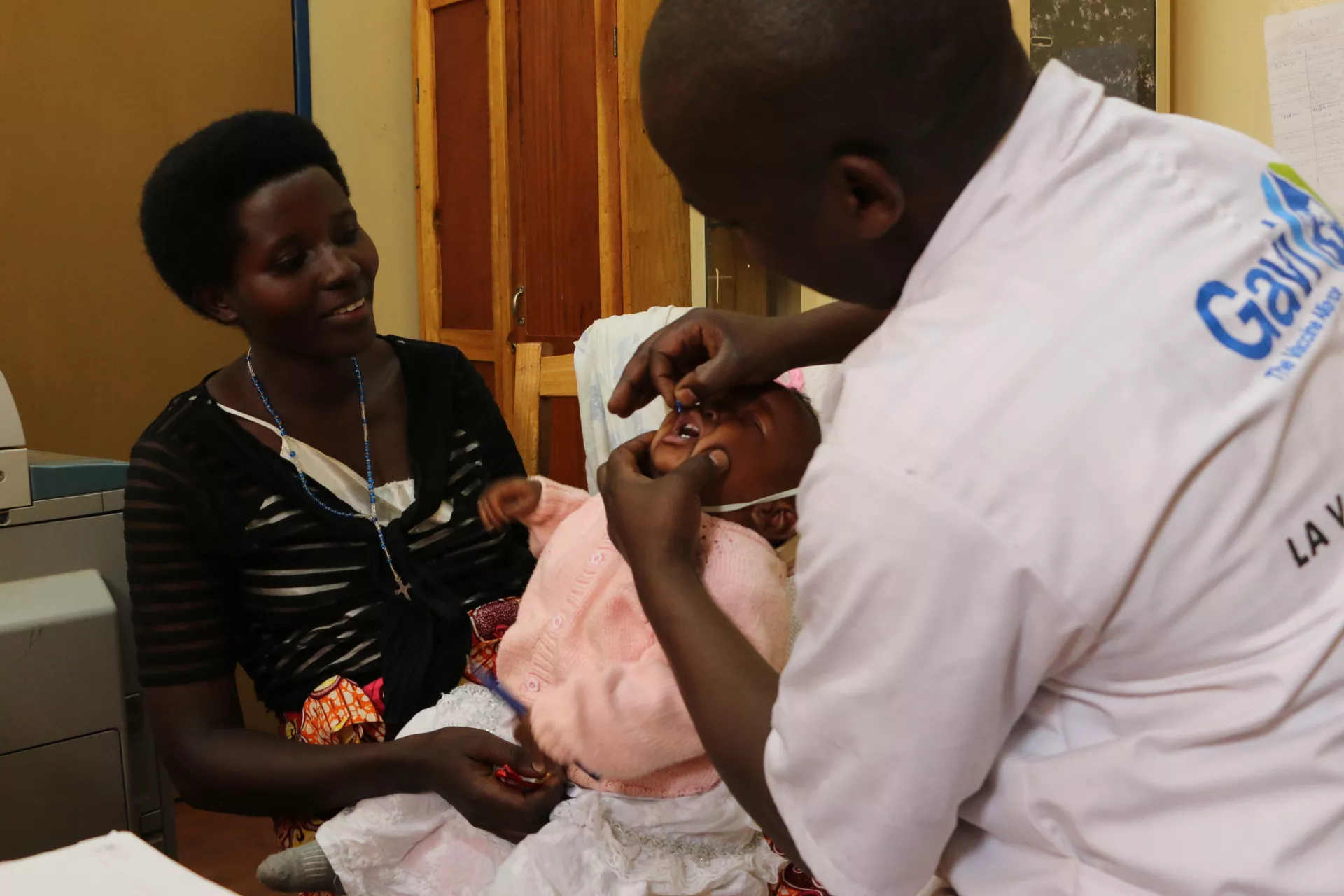  Administration of vitamin A and Albendazole to baby Anne Bercie Olga at the Ngozi health center.   