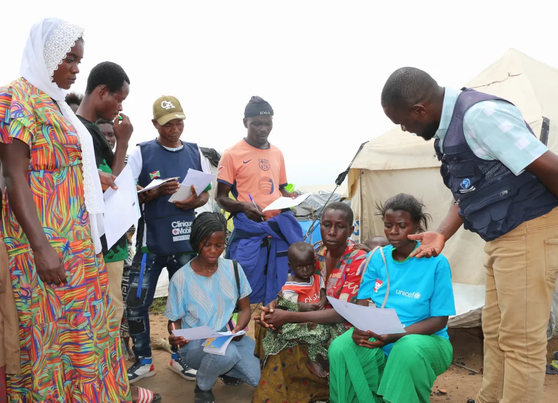Community health workers collecting data during a household visit in the Busuma site. 
