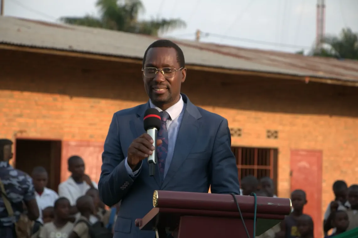 The Minister of National Education and Scientific Research delivering his remarks during the school desk handover ceremony at ECOFO Gatumba VII.