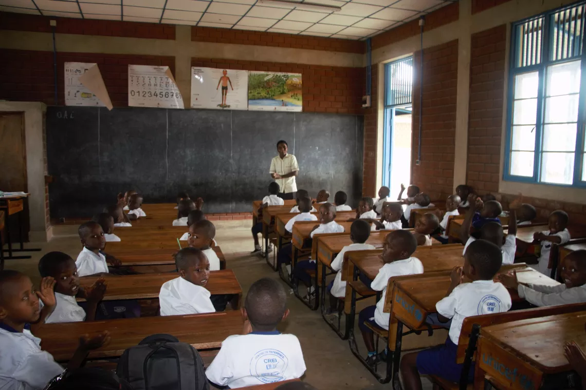 Gisele Byaomba, one of the CREI teachers, teaching the first-grade children 