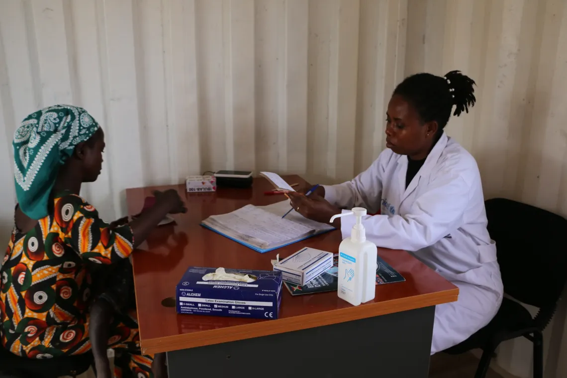 Dr. R&eacute;gine, head of the mobile clinic, during a consultation.