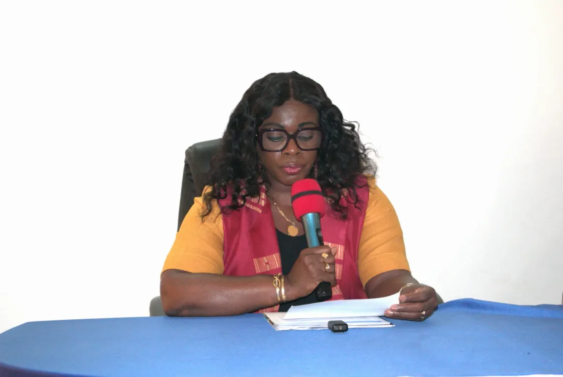The representative delivering remarks on the importance of water and sanitation