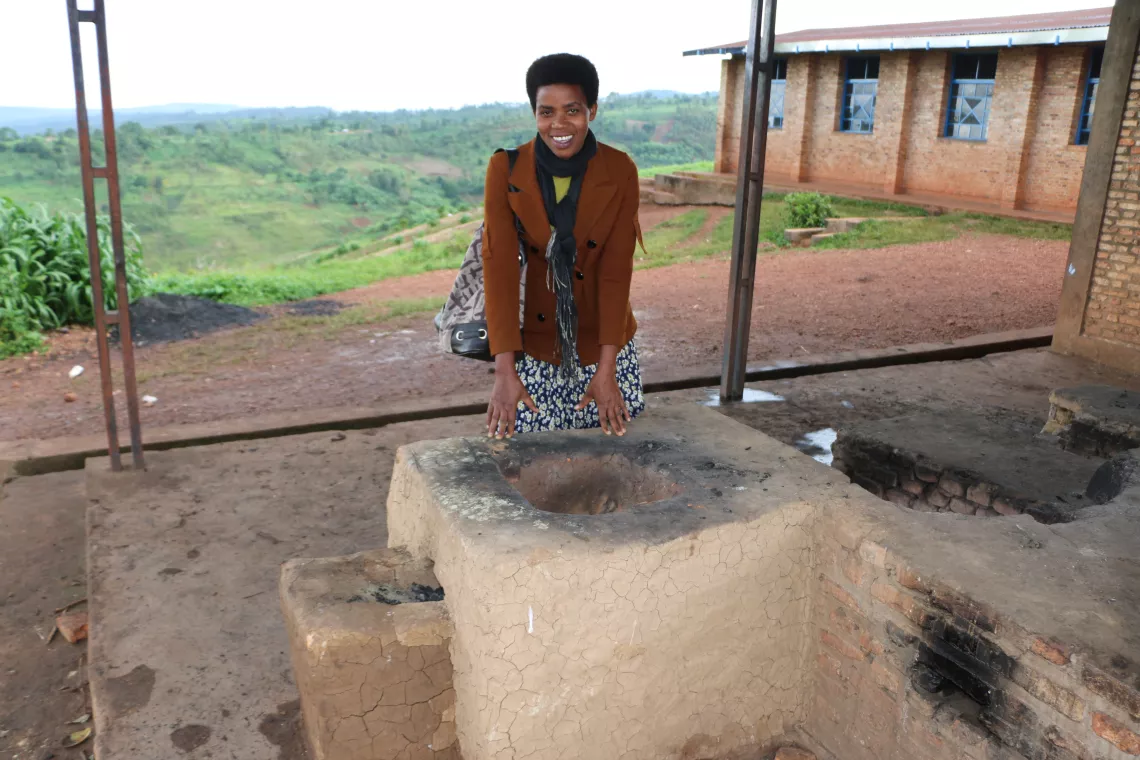 Isidonia by showing the big improved cookstove.