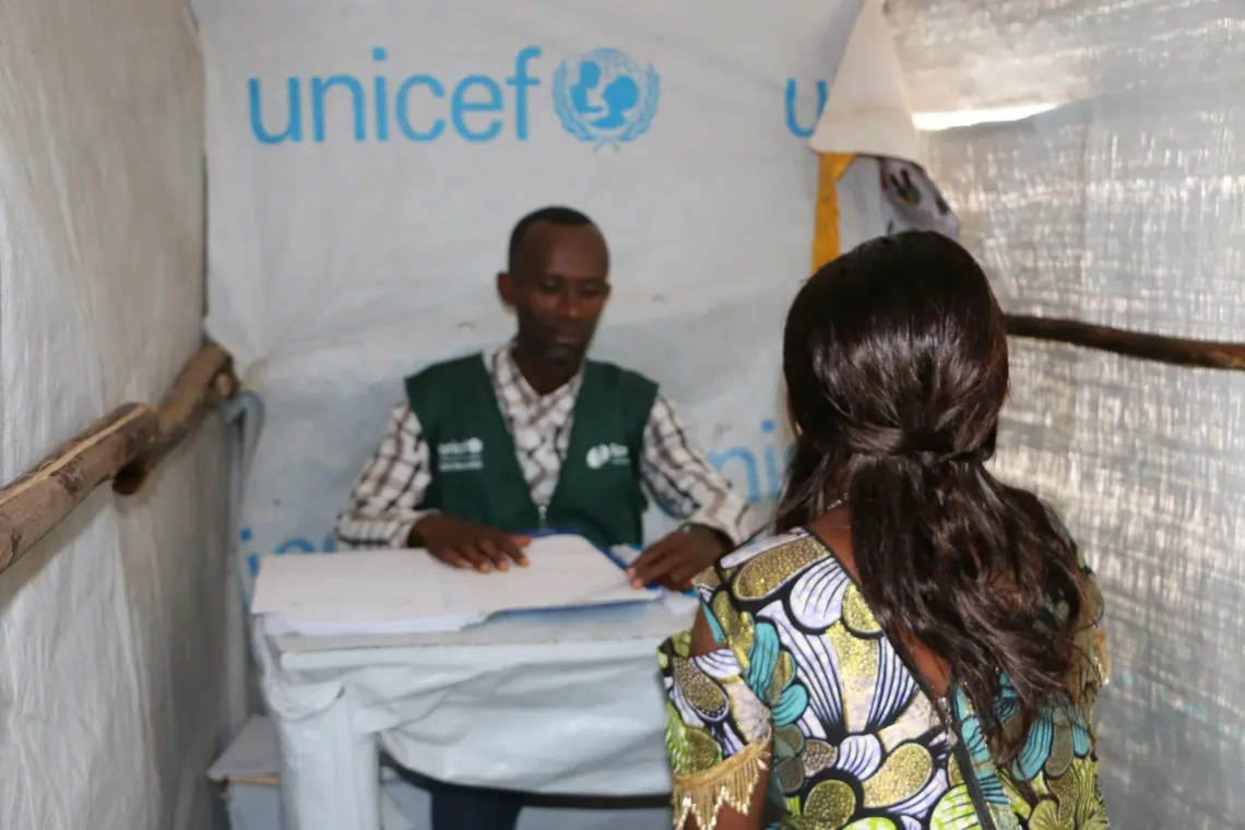 A young refugee girl getting a psychosocial support from Spring Communities at a listening center on the Busuma camp.