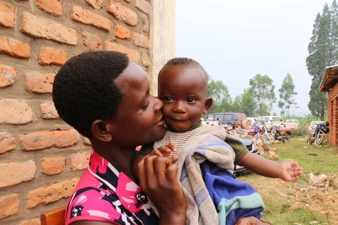 Nyabikere Chantal Habonimana, 26 years-old holding her son  Masezeranoyimana Jonathan, aged 6 months. 