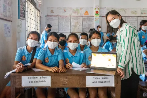 Sokunpanha LY, a young leader from UNICEF’s Generation Future, teaches children about beekeeping at Arranh Raingsei Lower Secondary School in Siem Reap