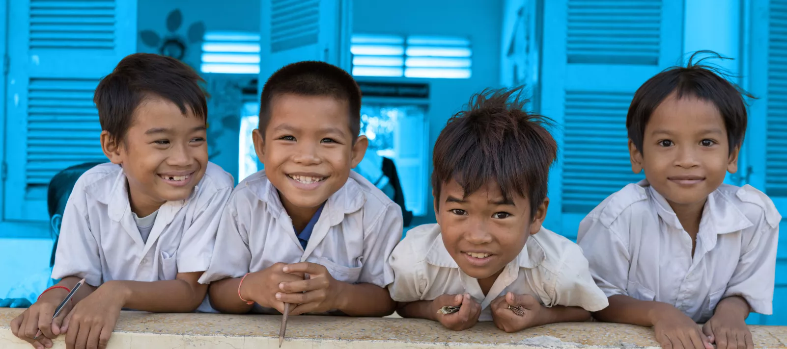 Children smile at the camera at Watanak Chhoung Leap Primary School in Sa&rsquo;ang District, Kandal province on July 2, 2018. 