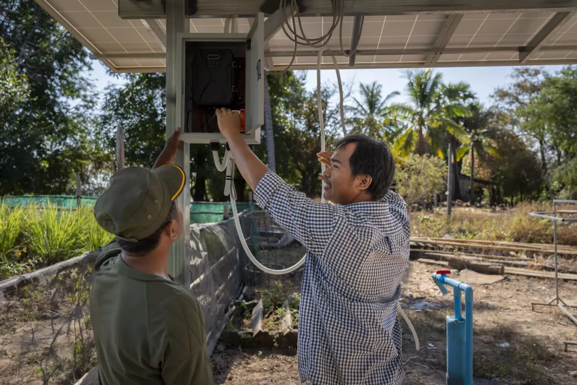 Kao Vibol (right), Chief of Rural Water Supply at PDRD in Kratie, has been supporting Kang Eang (left), leader of the village&rsquo;s Water Management Committee, to manage the operations of the community pipe system     