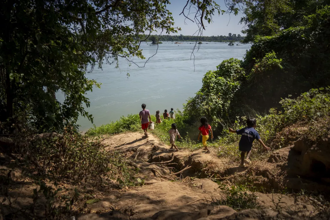 Until a UNICEF-support community pipe system was installed in his village, 29-year-old Tun Trea would make up to ten trips to the banks of the Mekong River to collect water for his family    
