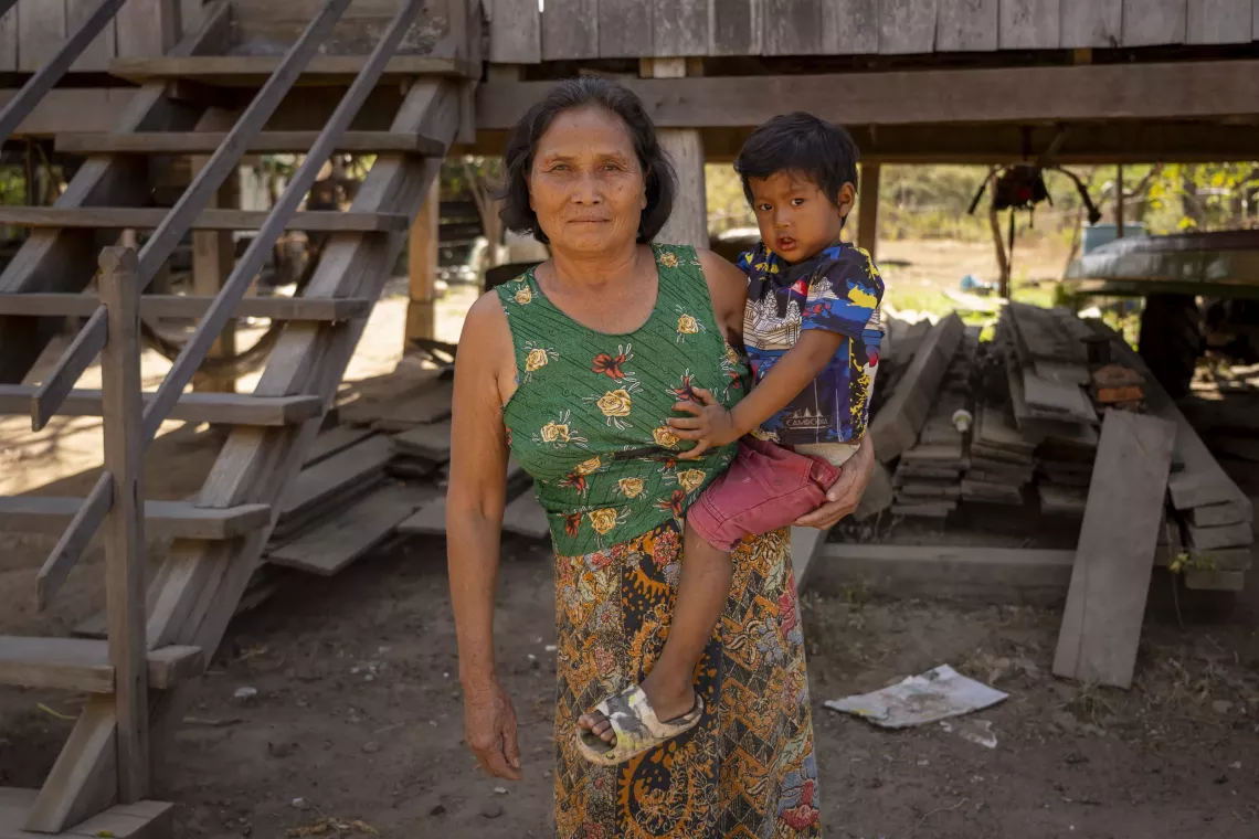 66-year-old Sat Sinry was one of the first in the village to connect her house to the community pipe system.