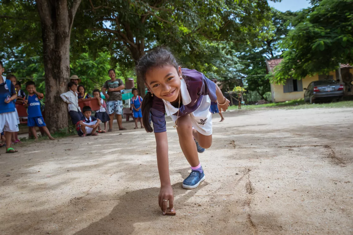 Students are playing hopscotch at the school playground. Peam Ror School. Peam Koh village. Peam Ror District. Svay Rieng Province. Cambodia, 2018