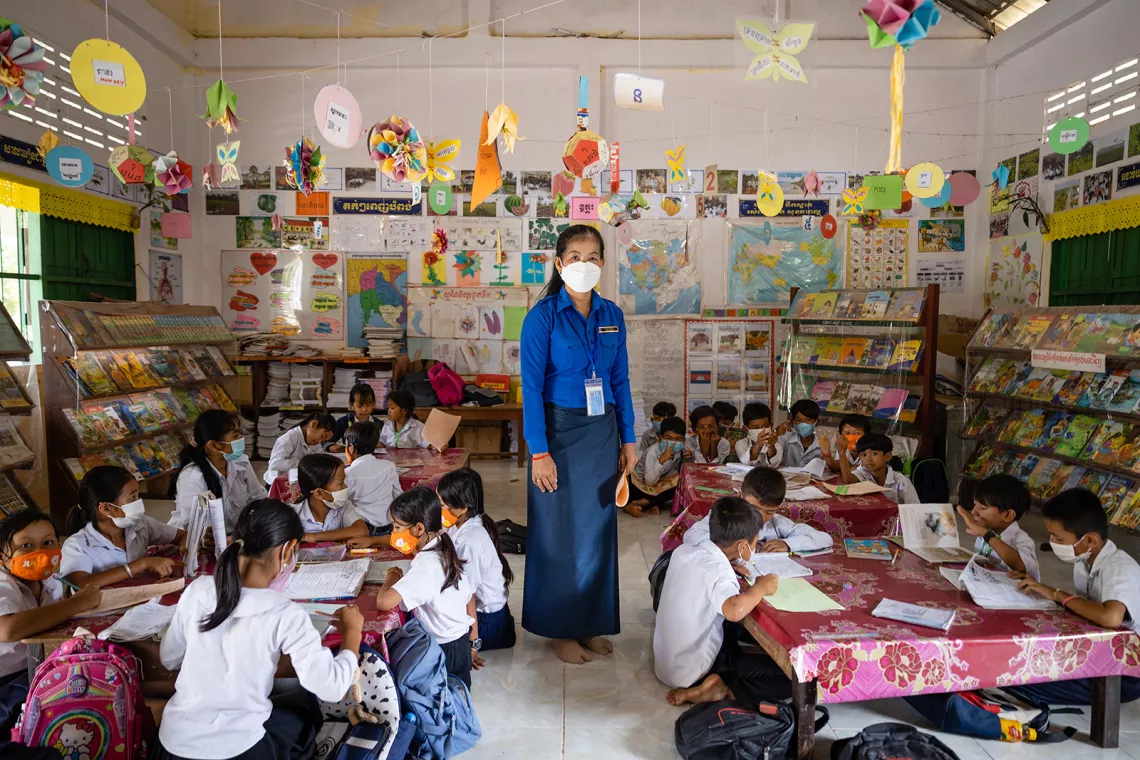 Ms Chuon Sophath, 44, a teacher and the librarian at Ang Run Primary School, posed in her classroom at National Highway 3, Tramkak District, Takeo Province, Cambodia. 